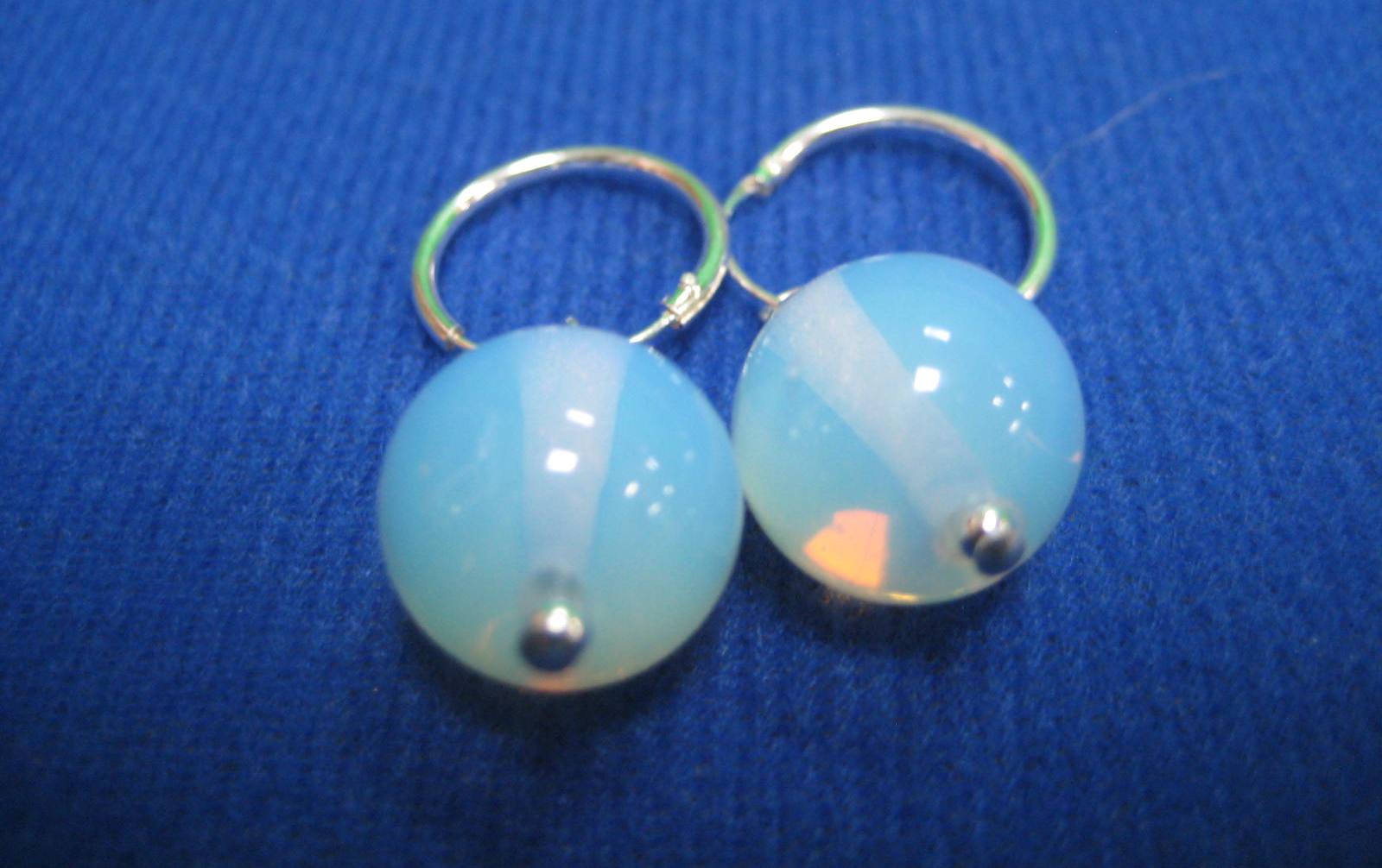 A pair of silver and moonstone ear-rings