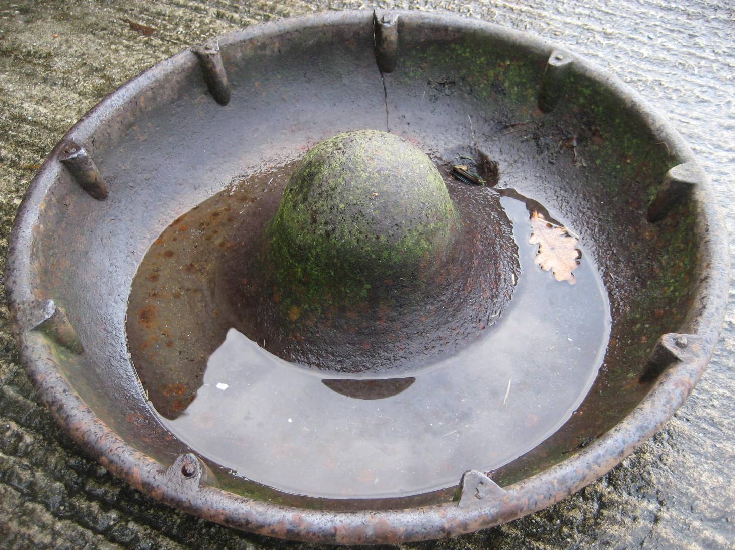 A cast iron pig trough