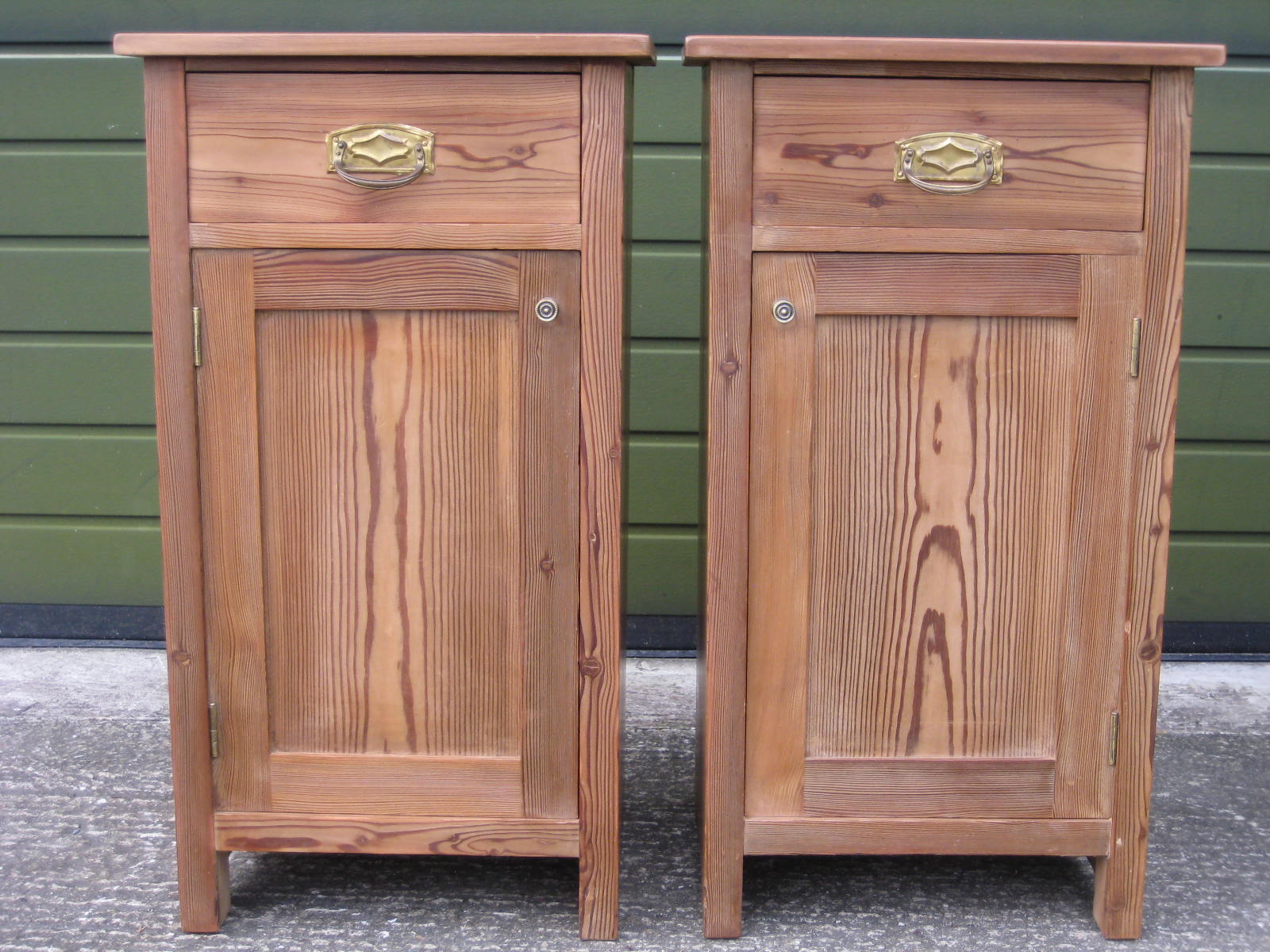 A pair of pitch pine bedside cupboards each with single drawer and cupboard