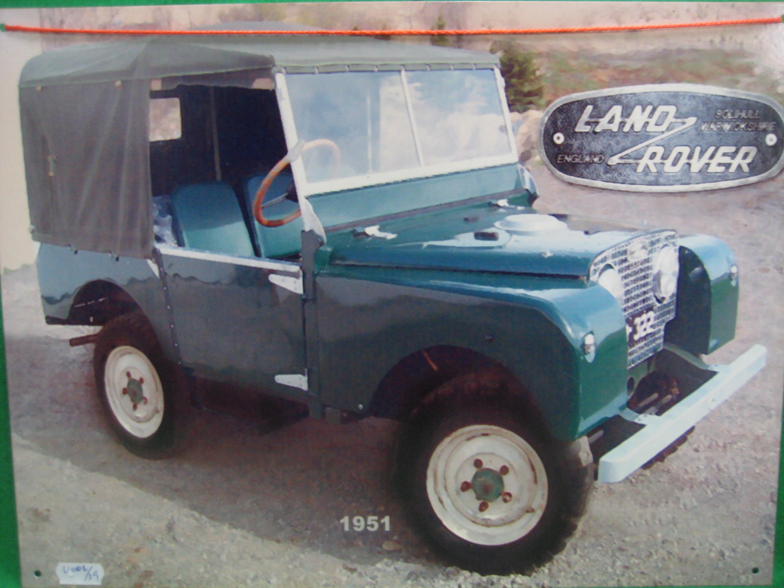 A tin advertising sign Land Rover