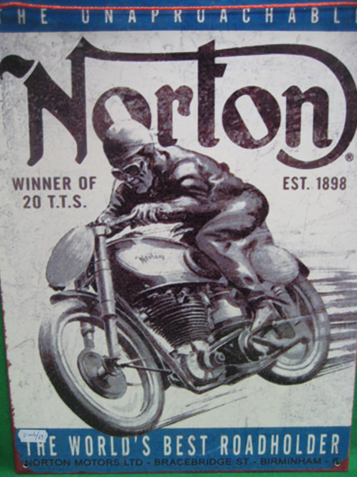 A tin advertising sign Norton cycles