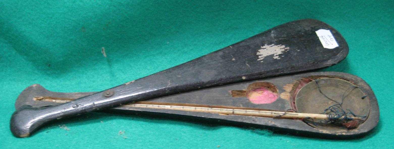 A set of oriental opium scales, in wooden sliding box