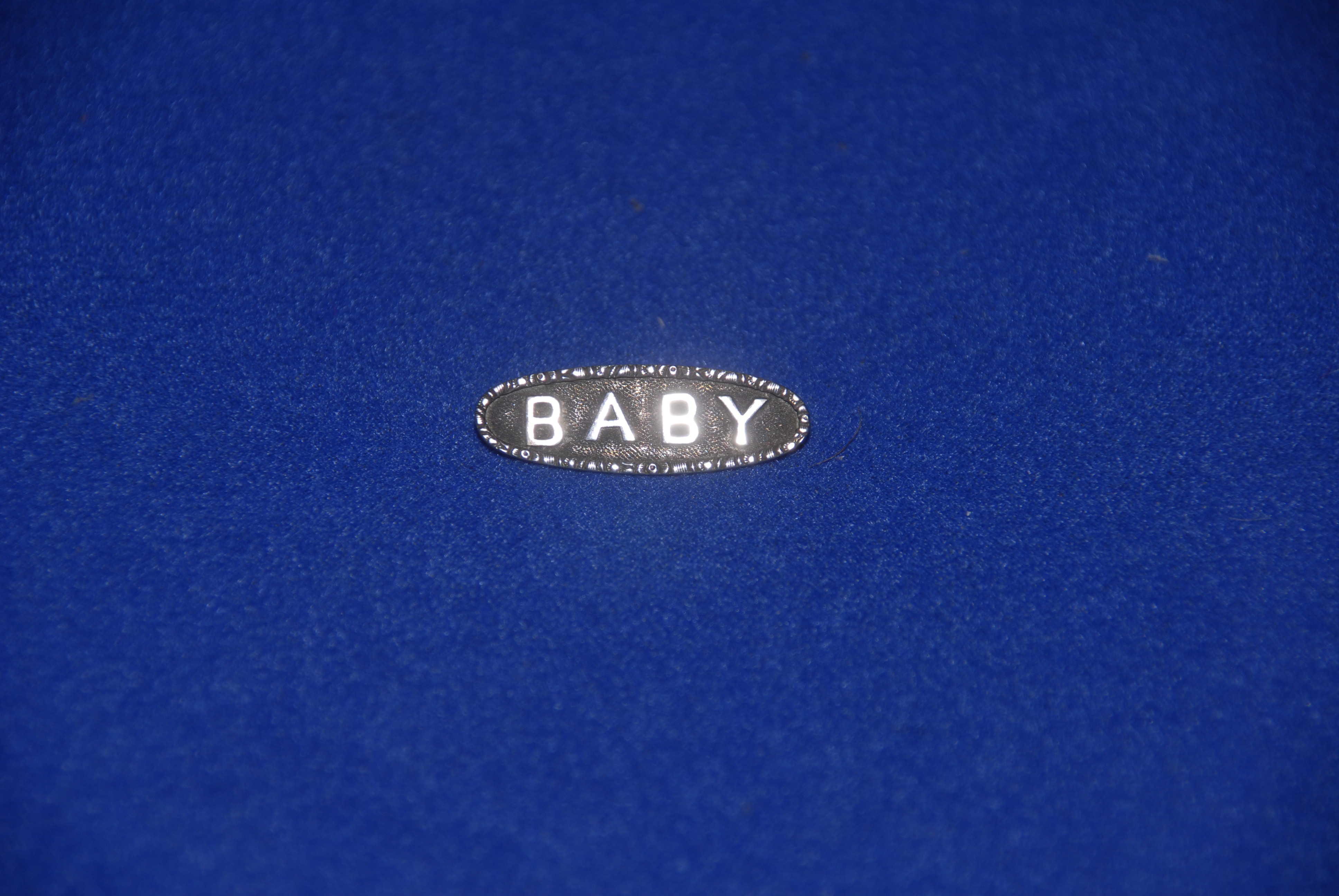 A Baby brooch, probably silver