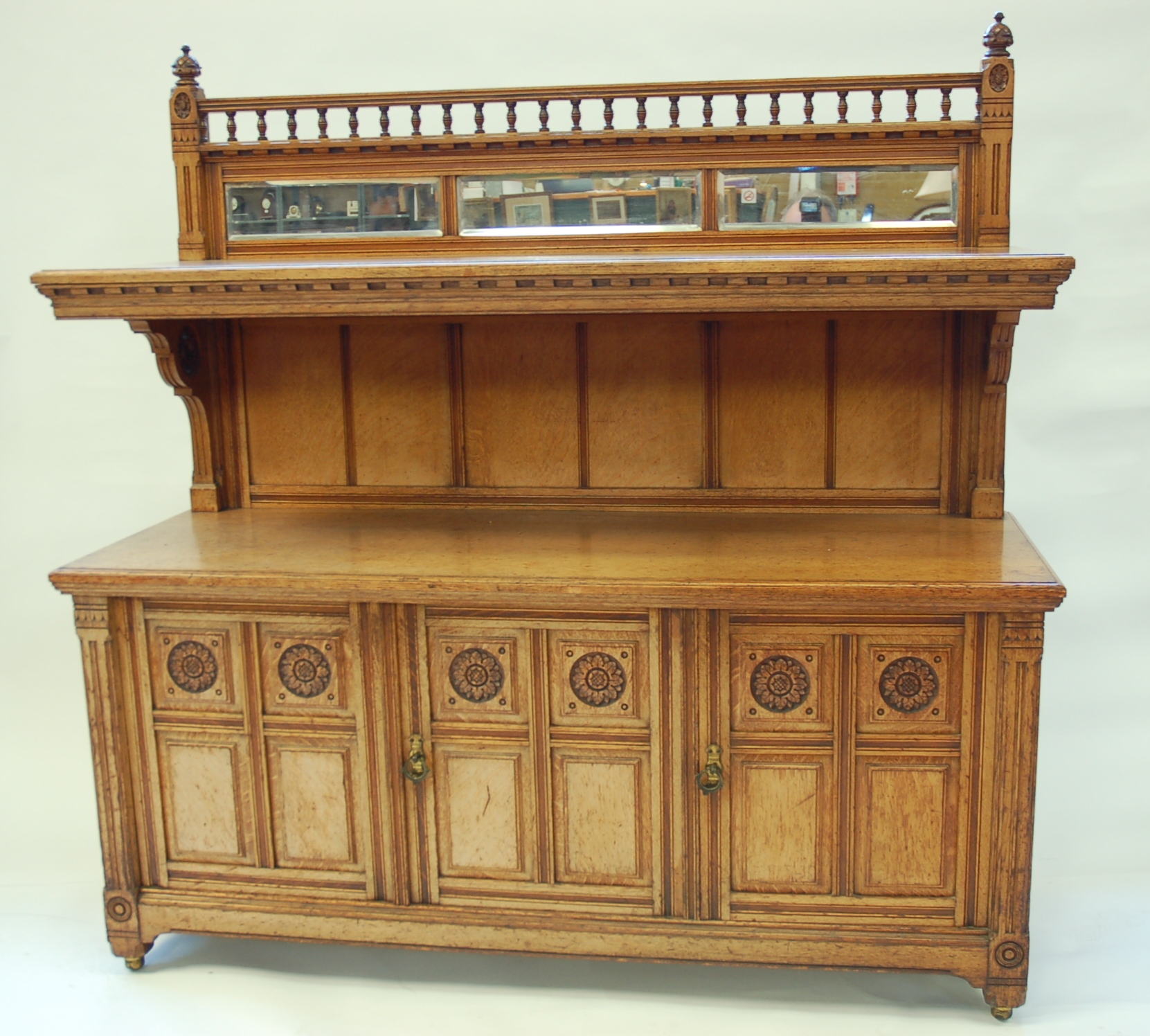 C. HINDLEY & SONS, 134 OXFORD STREET, LONDON, A LATE 19TH CENTURY OAK AESTHETIC MOVEMENT BUFFET-