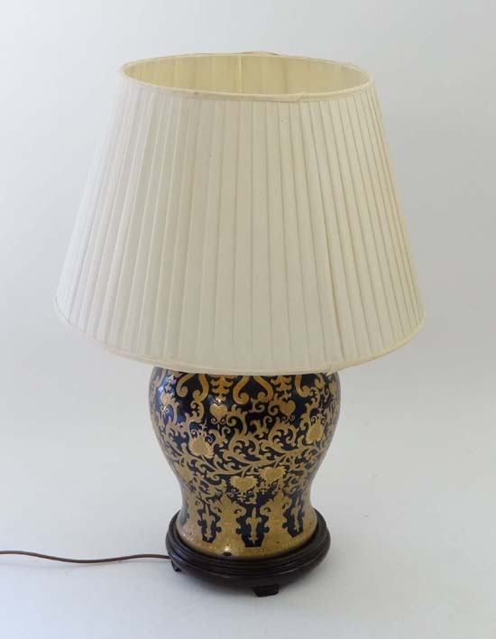 A Contemporary large baluster shaped table lamp with silk shade, the base of gilt and dark cobalt