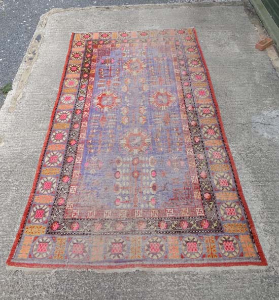 Rug / Carpet :a circa 1910 Samarkland carpet with geometric designs in red , white and blue to