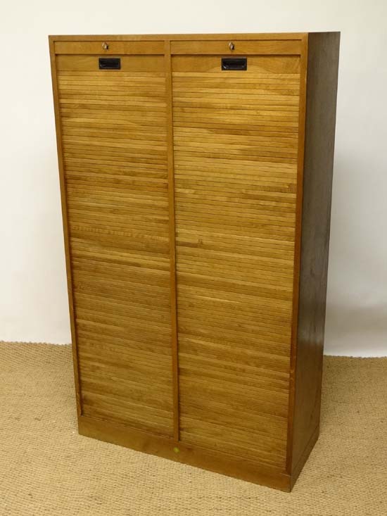 Vintage Industrial : a Danish teak twin Tambour front cabinet ( going top to bottom ) opening to