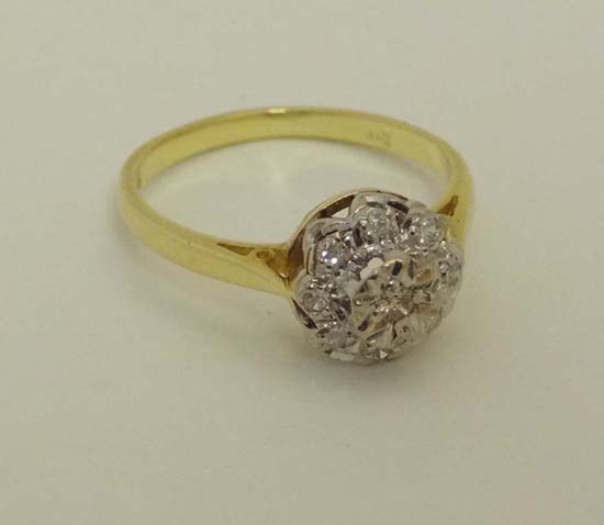 A 18ct gold ring set with diamond cluster