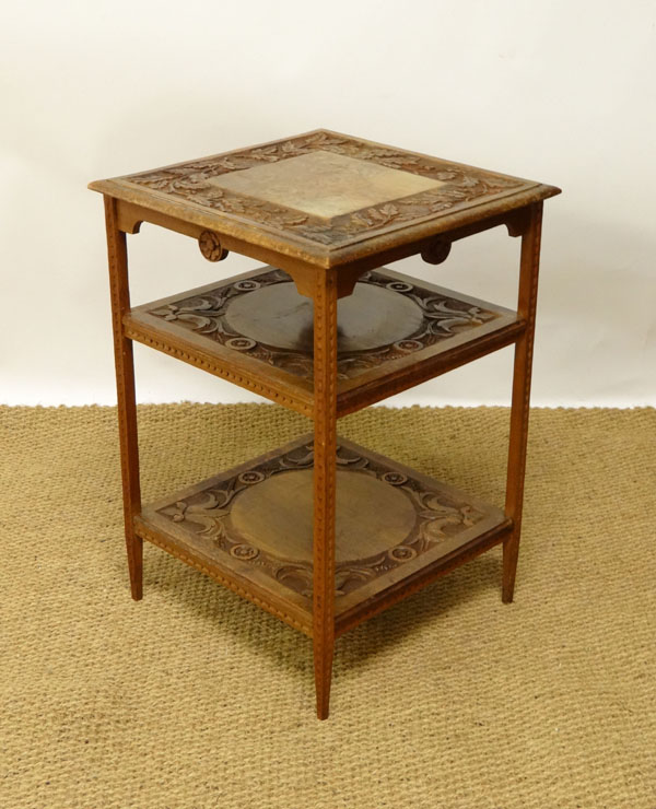 A late 19thC Arts and Crafts carved hardwood 3-tier occasional table with oak leaf decoration etc
