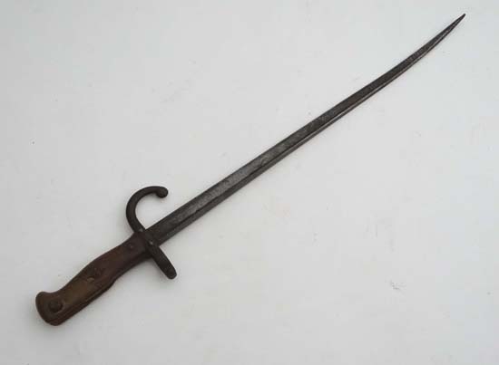 A French Gras M1874 bayonet bearing indistinct marks on the hilt. Overall length 24 3/4 inches