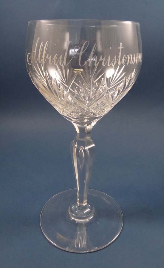 An old pedestal crystal tall wine glass with air inclusion to the hexagonal inverted baluster stem