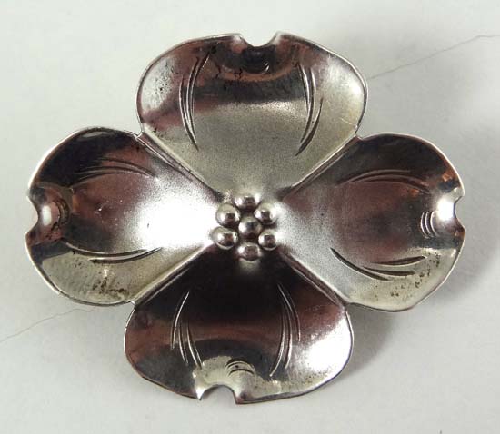 Stuart Nye : A Vintage Sterling silver brooch formed as a dogwood flower head marked NYE sterling