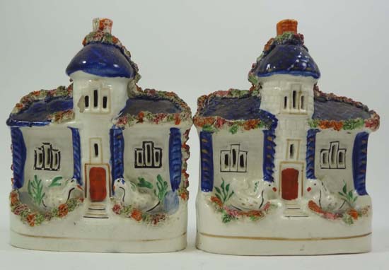 A pair of Victorian Staffordshire cottages having cobalt roofs and columns, extruded clay detail and