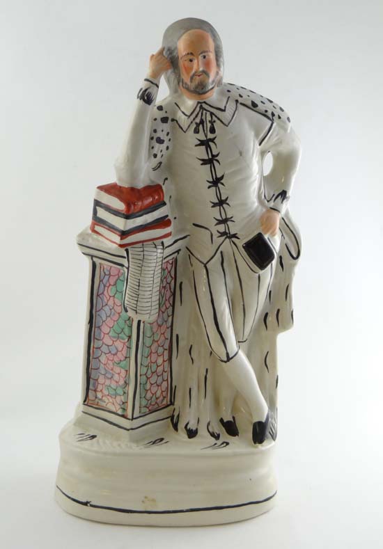 A tall Victorian Staffordshire pottery figure by Sampson Smith depicting William Shakespeare