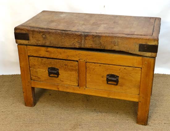 A 4ft butchers block on a pine base with 2 deep drawers.