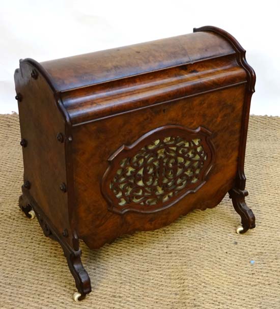 An unusual burr walnut and fretted hinged lidded Victorian Canterbury on four porcelain castors 21