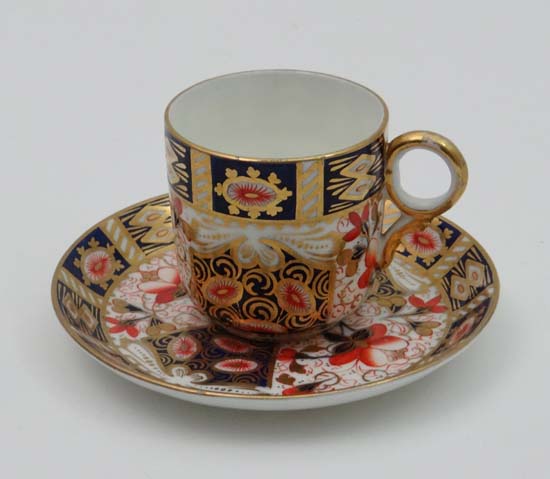 A Crown Derby cup and saucer decorated in Imari palette in pattern 2614. (2)