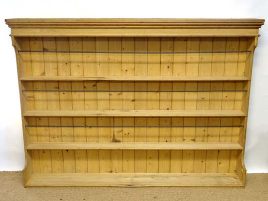 A Contemporary stripped pine open four shelf dresser approx 72 1/2" wide x 54" high