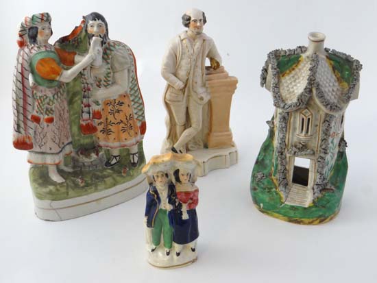 A collection of four Victorian Staffordshire items comprising a rare pastille burner in the form