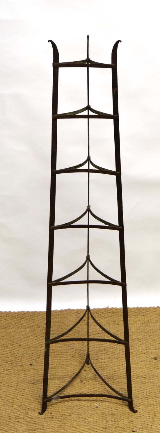 A wrought iron 3-legged 7 tier kitchen saucepan stand 55 1/2" high