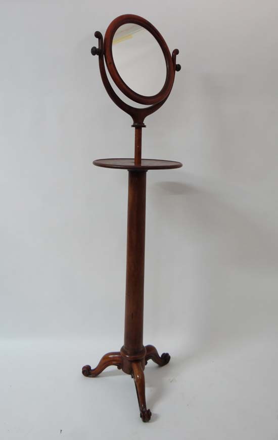 A Victorian mahogany tripod pedestal adjustable height shaving stand.