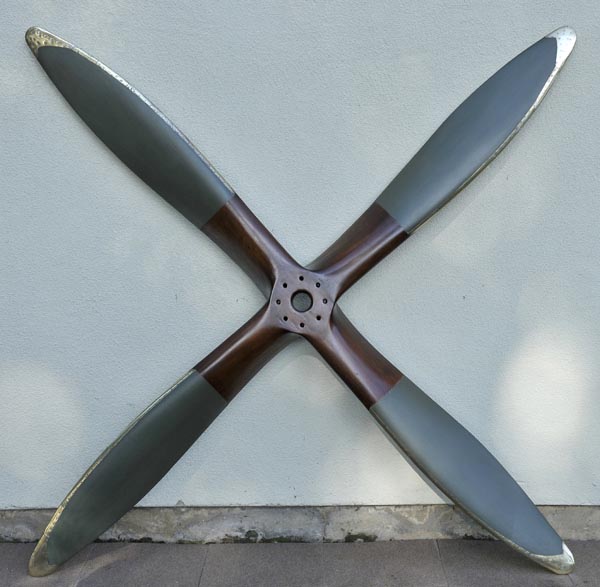 * Propeller. An exceptionally rare laminated mahogany four blade propeller, late 1920s, stamped