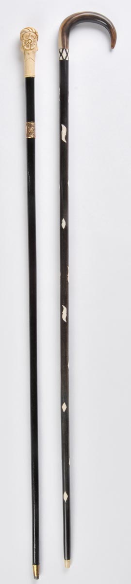 *Walking Cane. An ebony cane, with bone inserts throughout and curved horn handle, 93cm long,