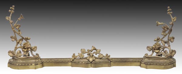 * A Victorian gilt metal fire fender, with integral andirons, 137cm wide, together with various