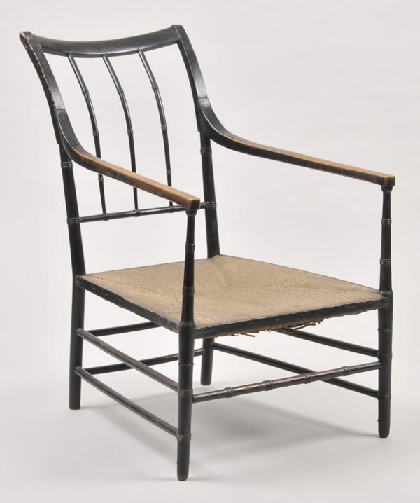 * A Victorian Arts and Crafts ebonised armchair, possibly a William Morris Sussex design chair,