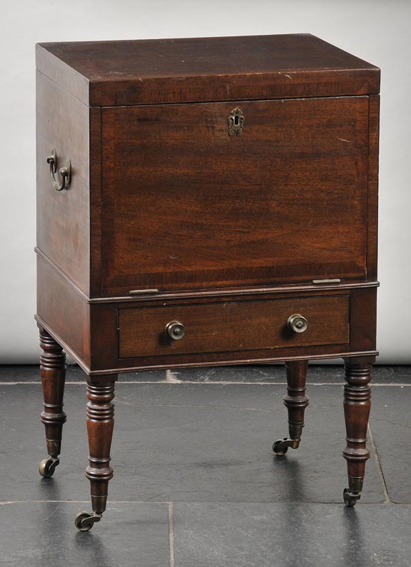 * A 19th-century mahogany cabinet, adapted to allow the front panel to fall forwards, enclosing