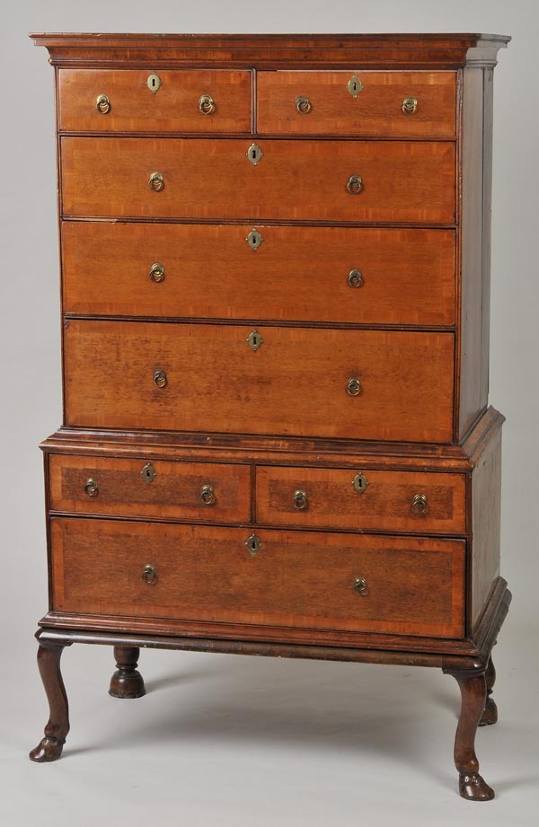 * An Irish 18th century herringbone banded and yew crossbanded chest of two short and three long