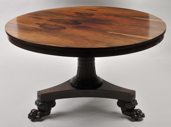 * A good William IV rosewood breakfast table, the circular top over geometric carved pedestal, on