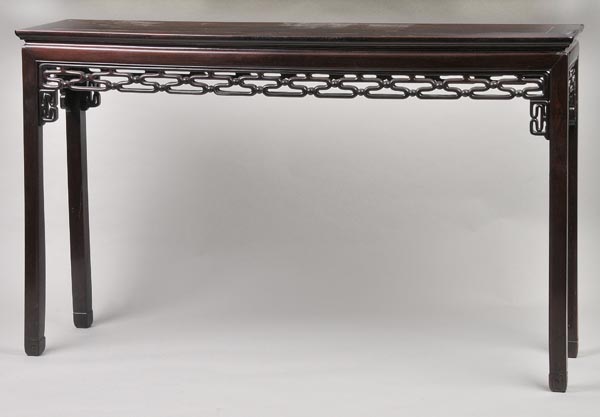 * A Chinese rosewood altar table, early 20th c., the rectangular top over fretwork design, on four