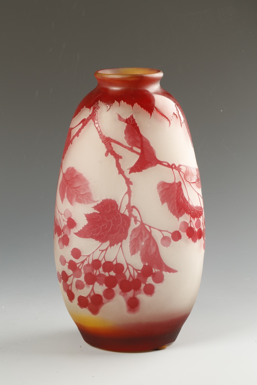 GALLE: A CAMEO GLASS VASE of compressed ovoid form decorated with leaves and seed pods in red