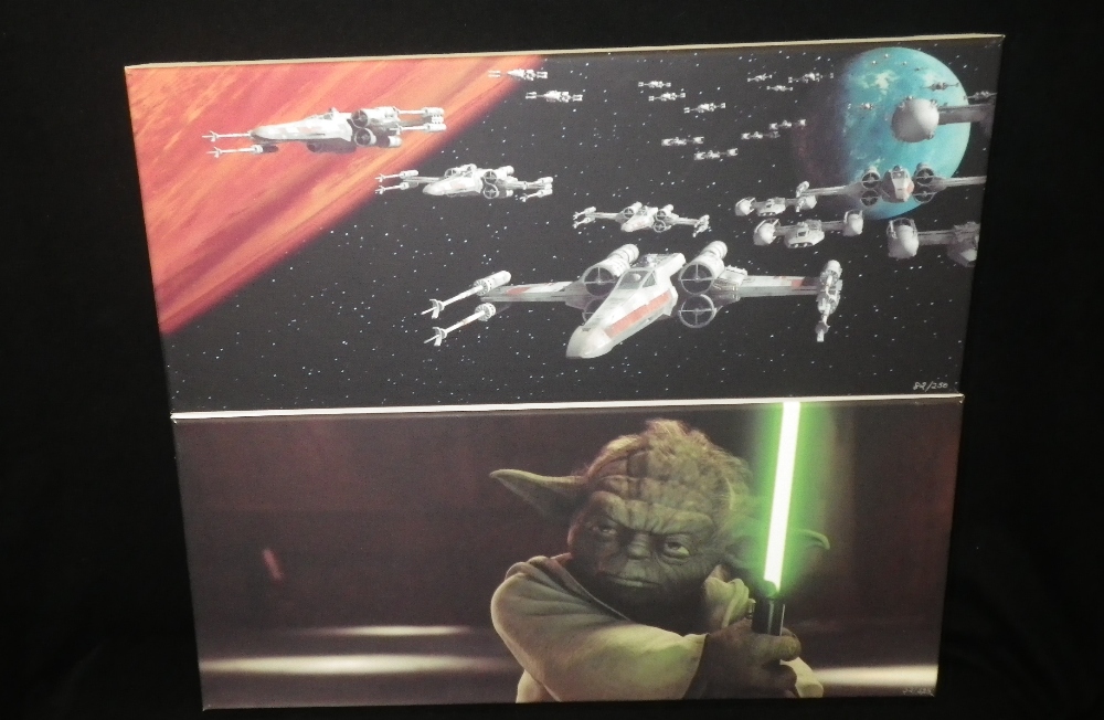 Two limited edition prints on canvas, one of Yoda holding a light sabre, No. 52/325, the other No.