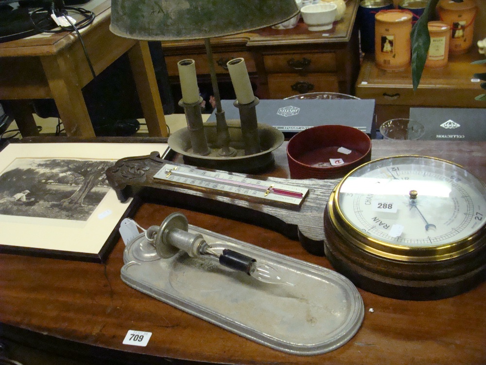 An oak banjo barometer, cast aluminium wall lamp, a Regency design metal table lamp, a papier