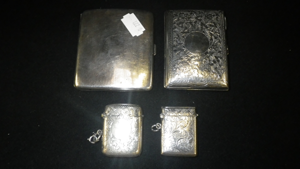 A collection of silver cigarette cases and vesta cases