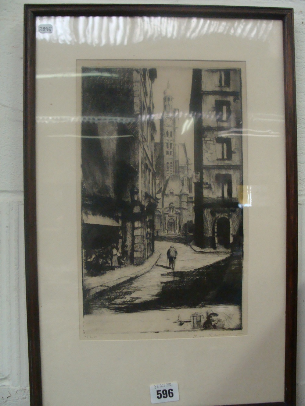 An early 20th century etching depicting a Continental street scene, No. 6/25 and indistinctly signed