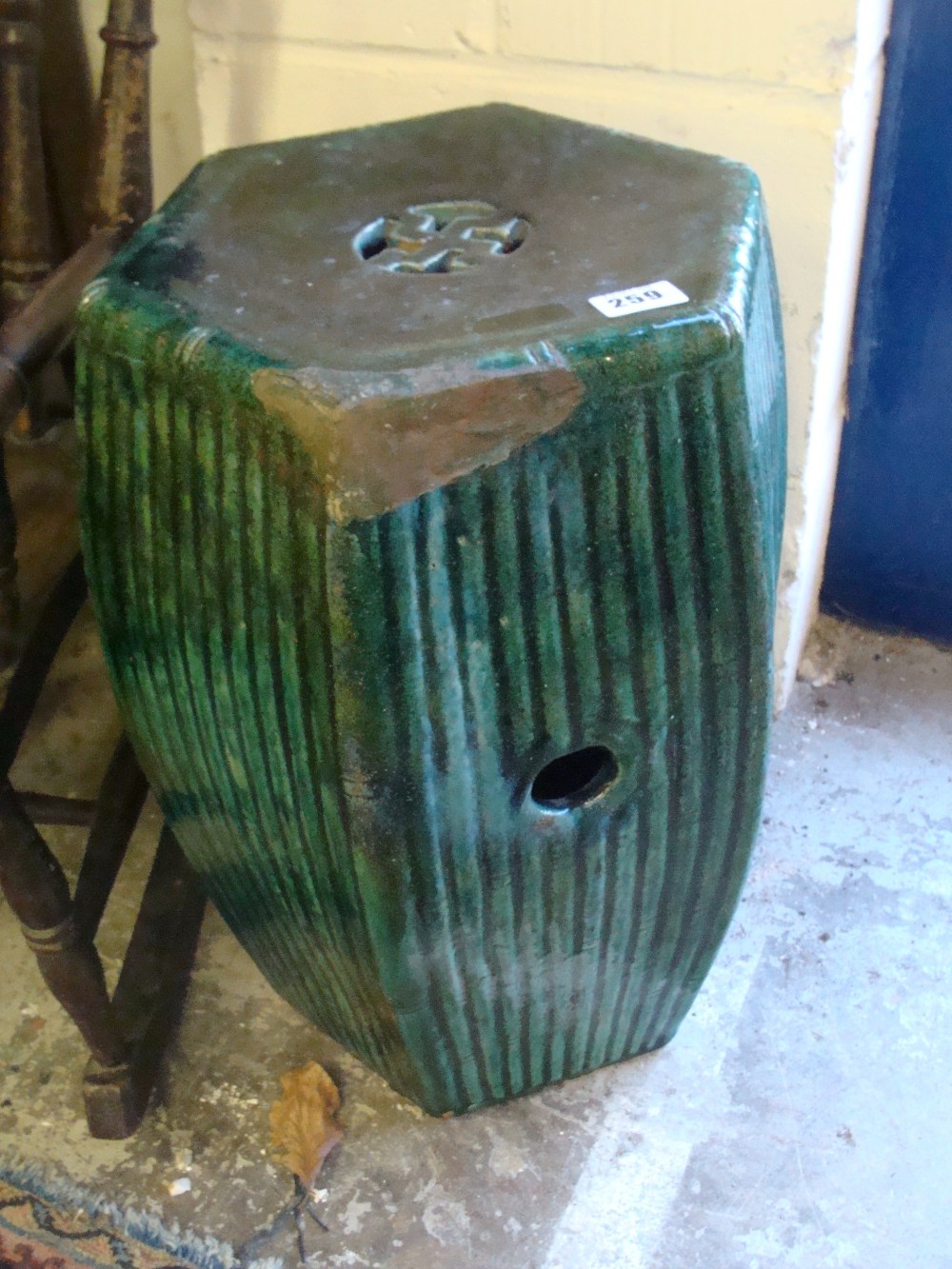 A hexagonal garden seat with reeded body with a green glaze, late Qing/Republic
