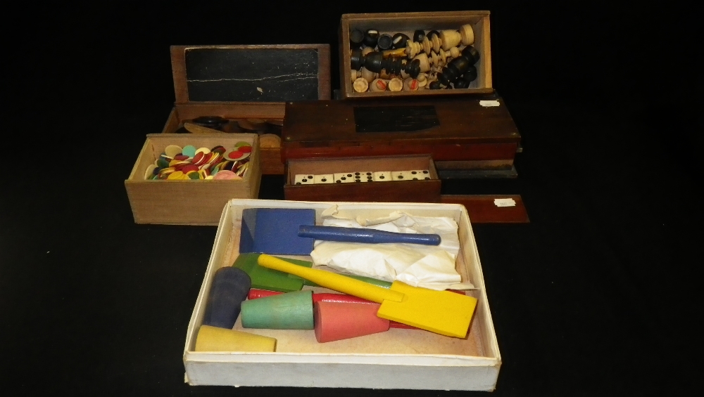 A collection of vintage toys to include `squails`, a chess set, draughts and similar items