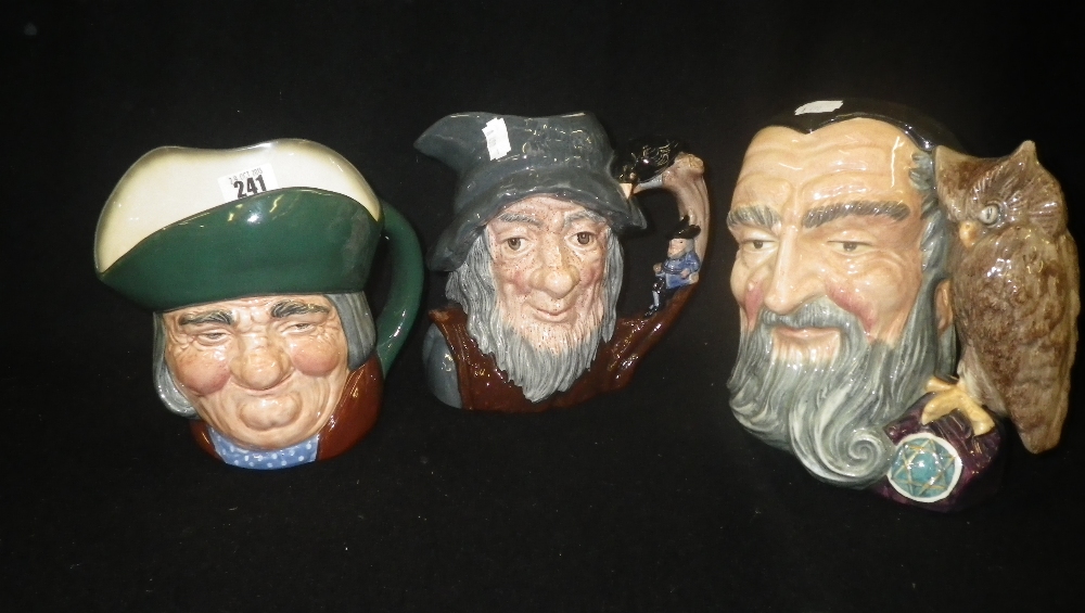 Three Royal Doulton character jugs, Toby Philpots, Merlin, and Rip Van Winkle