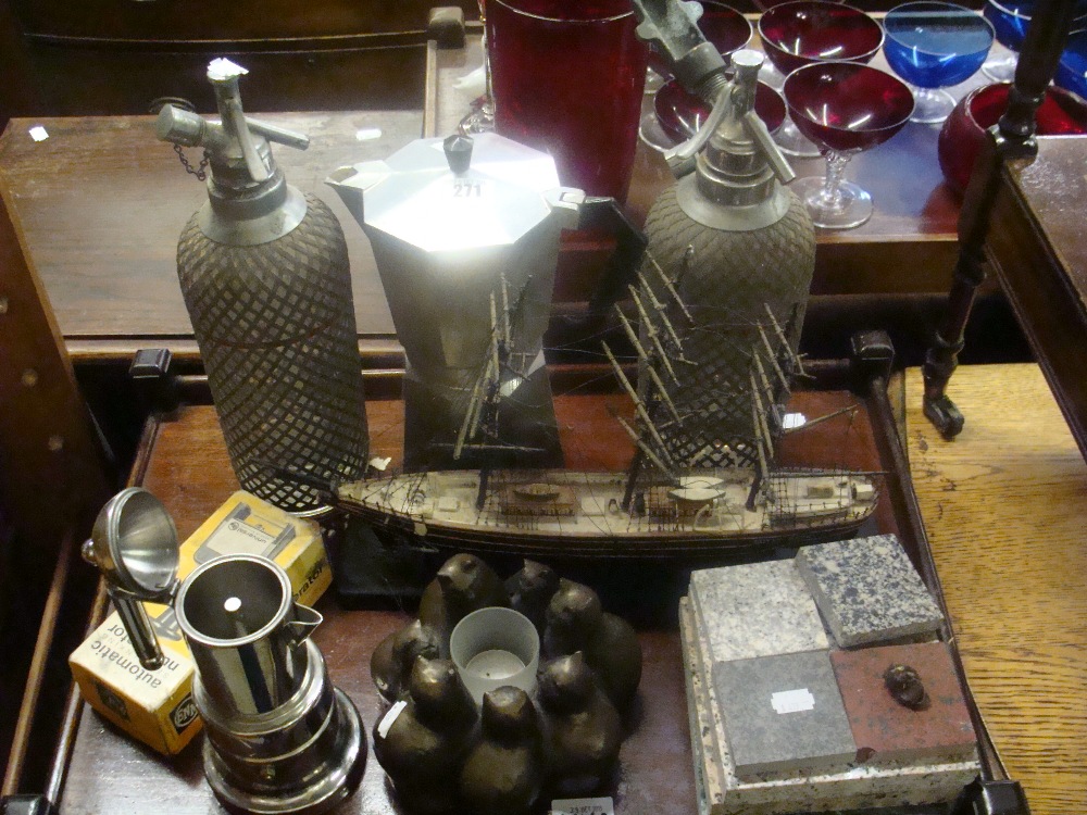 Two wire covered soda siphons and similar items