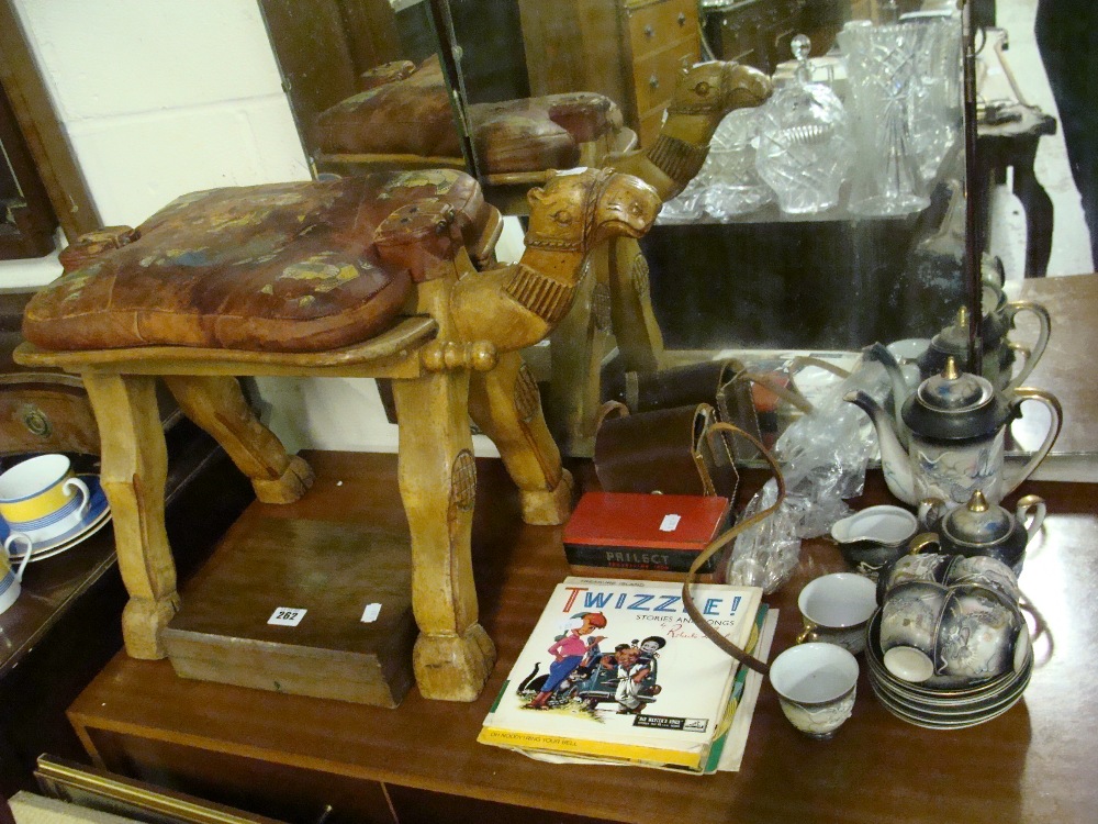 A camel stool, a set of fish knives and forks, a collection of vintage children`s 45 rpm records,