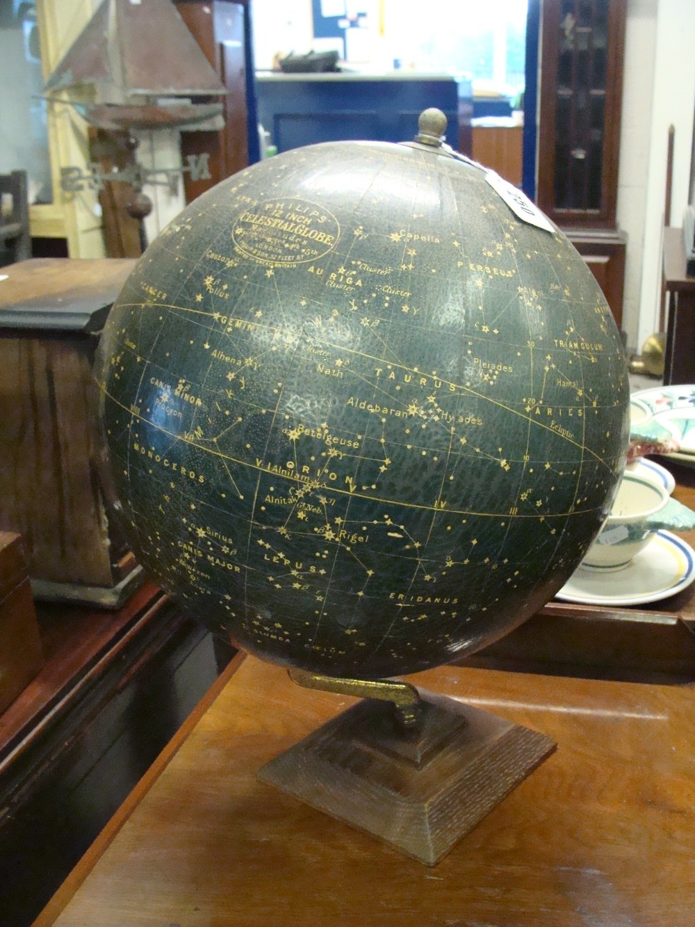A Philips` 12" celestial globe on an oak base