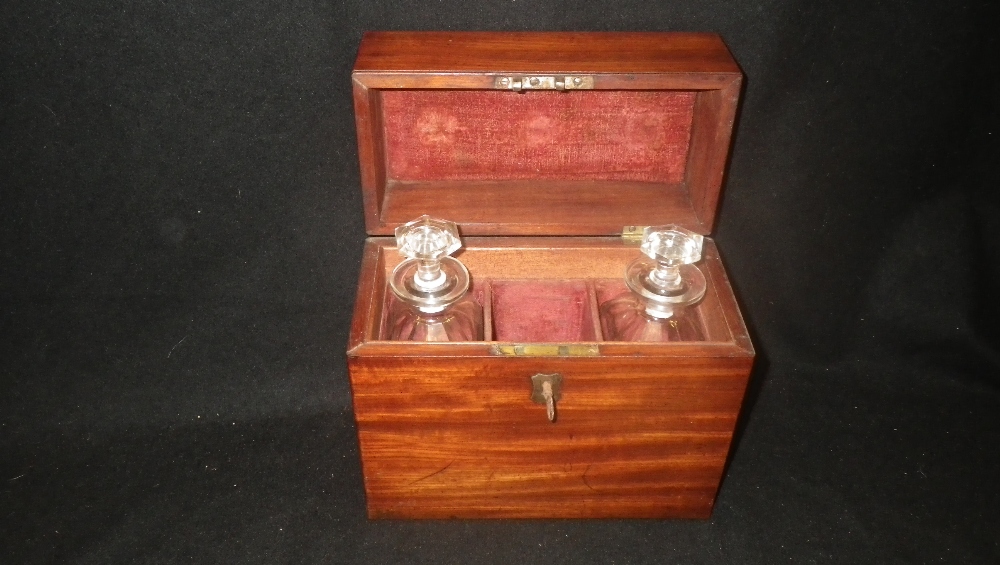 A 19th century mahogany box containing two glass decanters