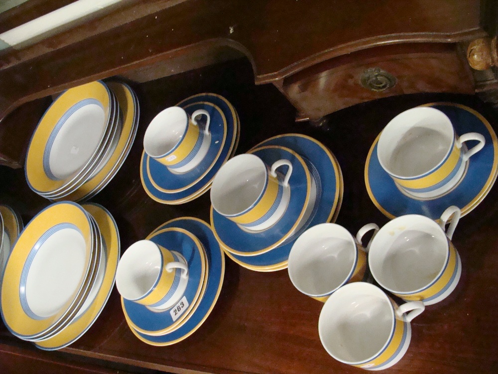 A collection of Japanese Mimosa yellow and blue dinner and teaware