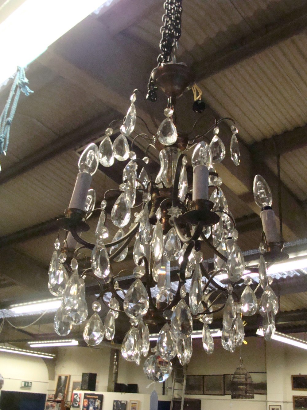 A French style brass framed chandelier with cut-glass droplets