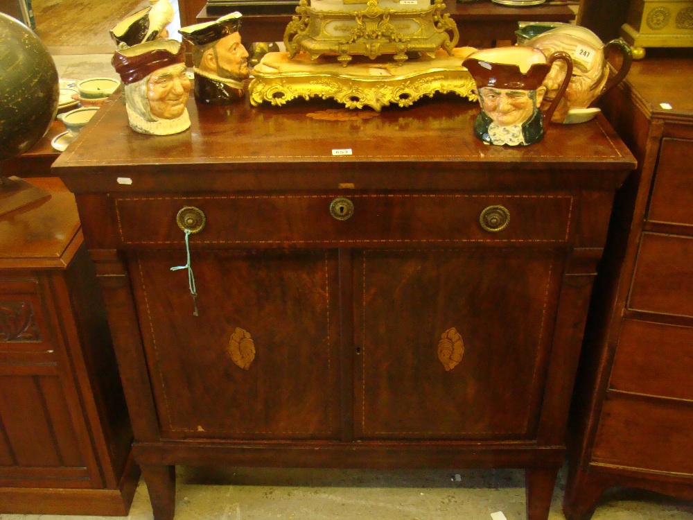 A Continental figured mahogany side cabinet fitted a single drawer with doors below decorated with