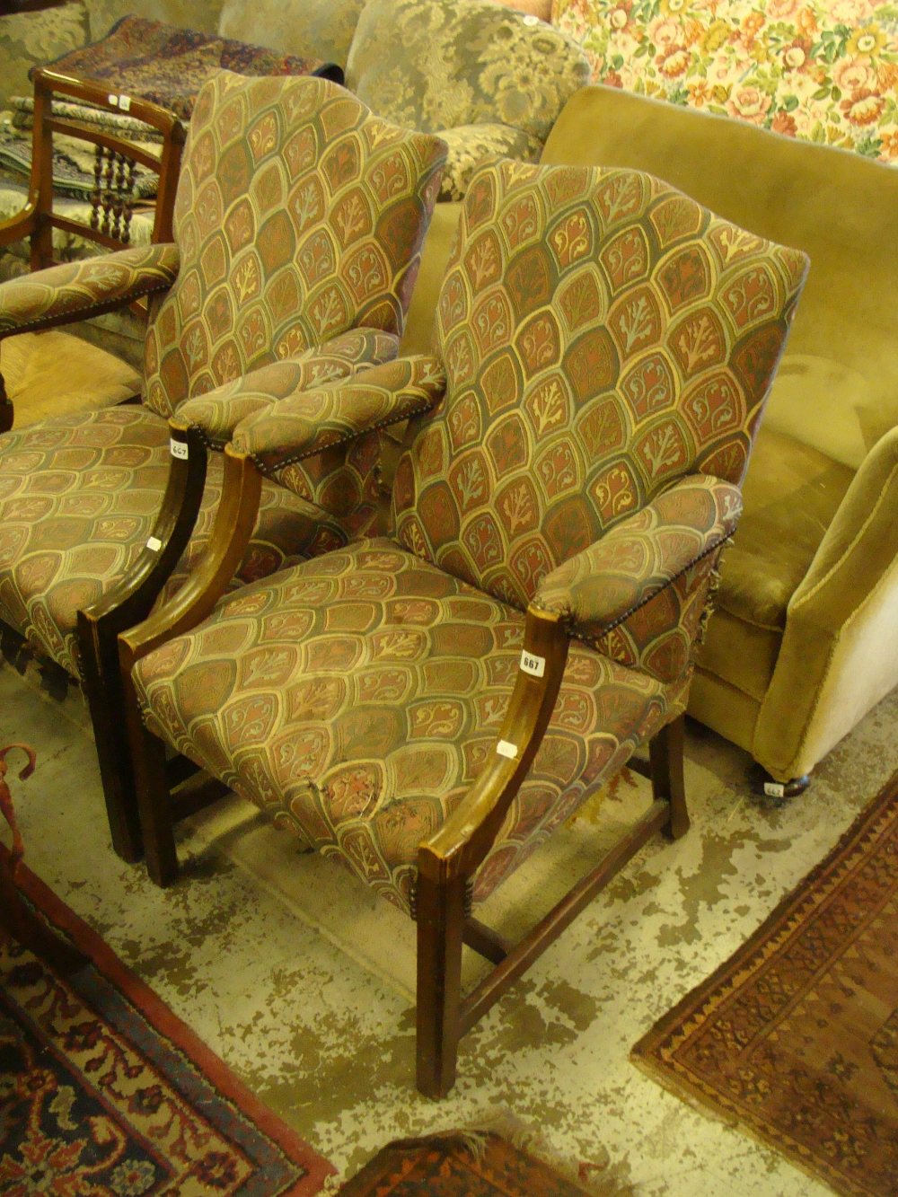 A pair of reproduction Gainsborough style upholstered armchairs