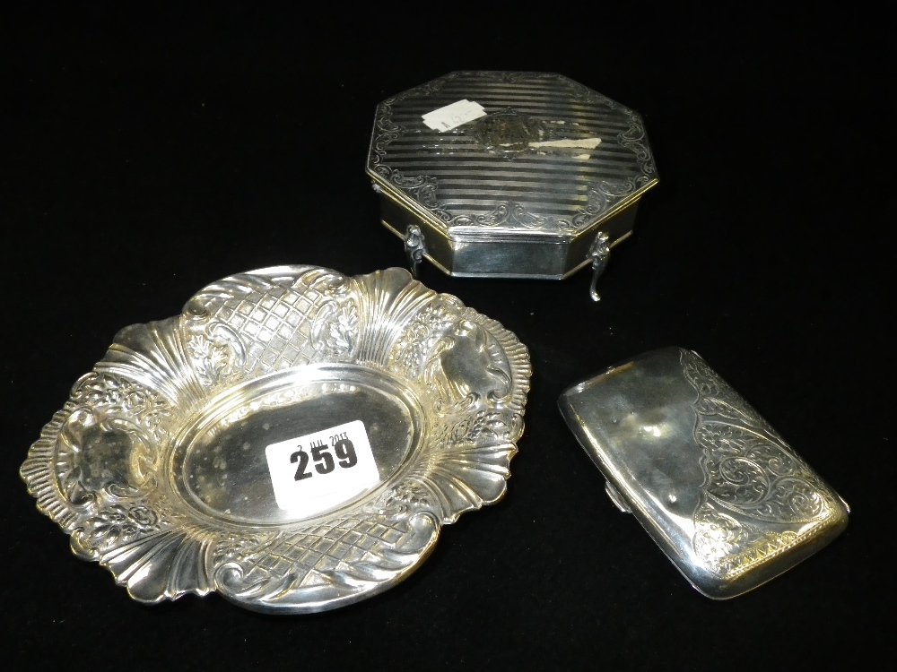 An octagonal silver trinket box, an oval silver tray and a silver cigarette case (3)